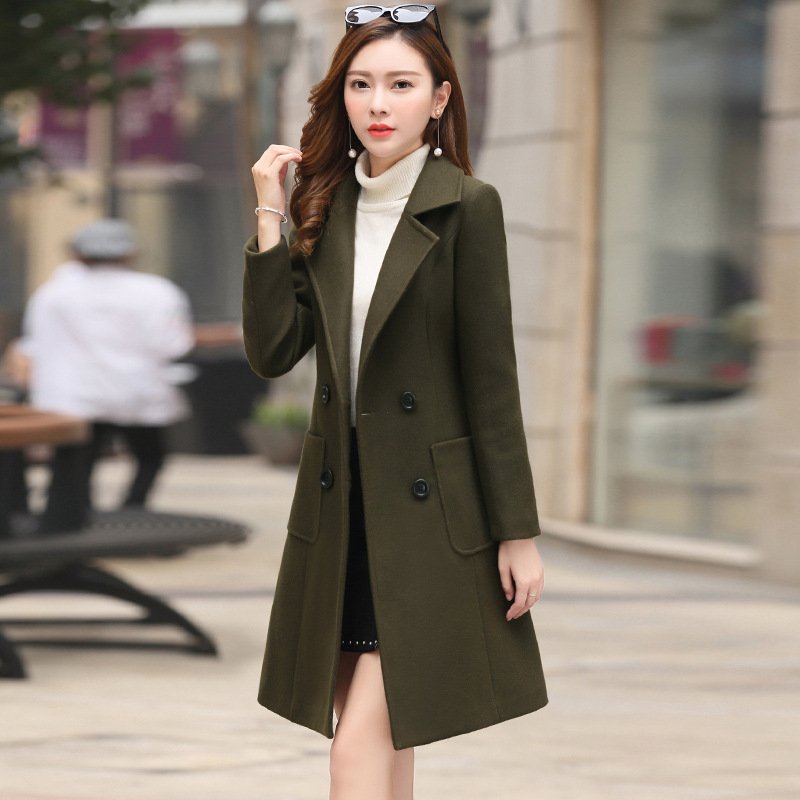 1630414424386.jpg The vintage windbreaker pulls in the knee-length tweed coat